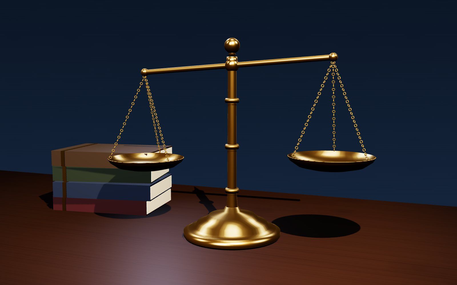 Brass scales of justice beside law books